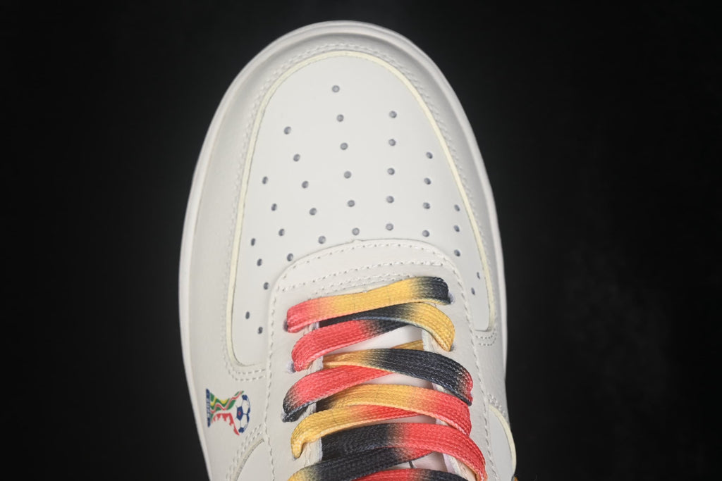Close-up of the white perforated toe box and multicolor laces on the Nike low-top sneaker.