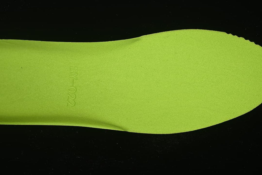Close-up of the bright lime-green footbed