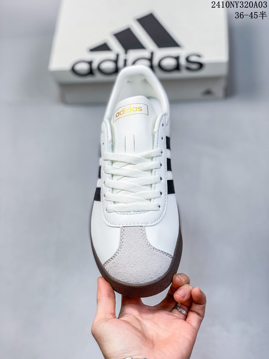 Front view showing the laces and light gray toe panel on the Adidas sneaker