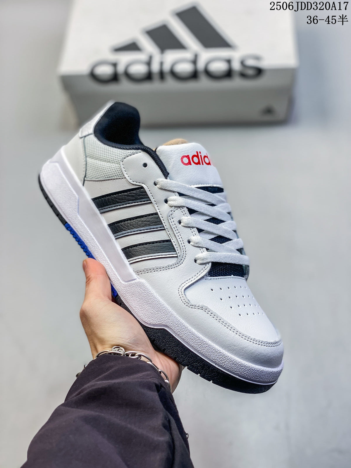 White adidas Entrap sneaker with black accents and a blue detail on the outsole.