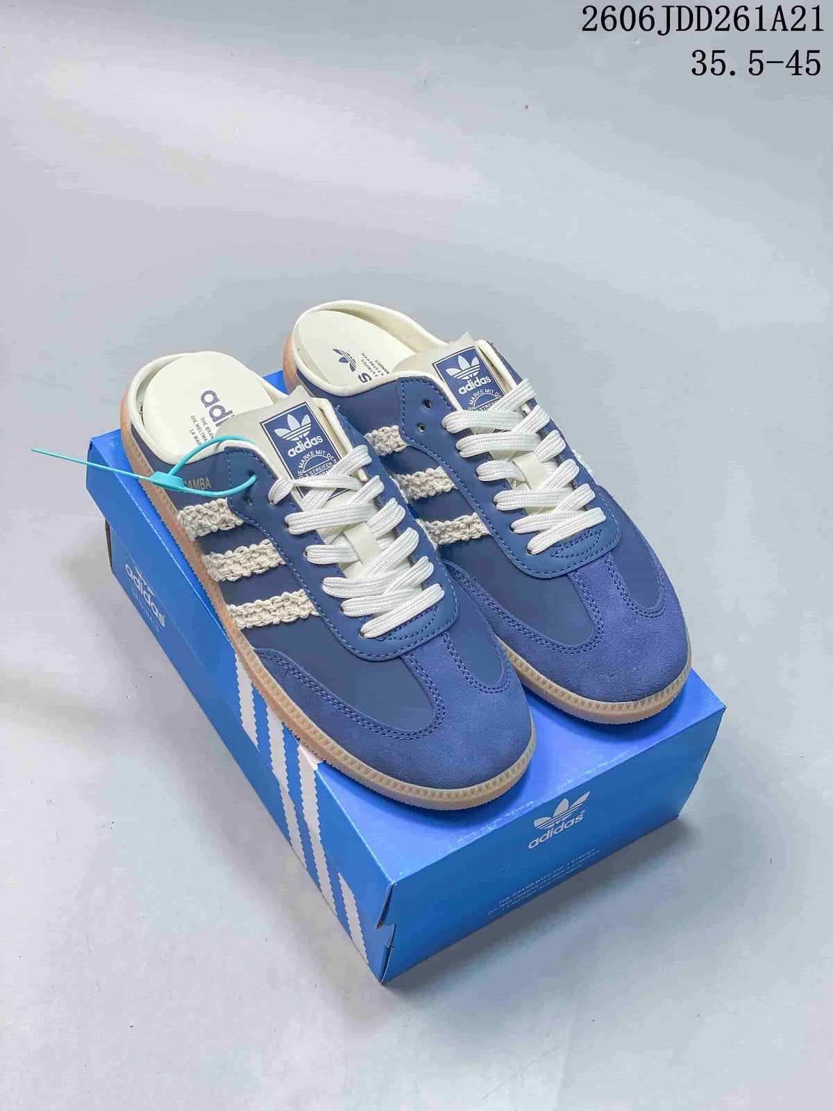 Blue and cream adidas Samba Mule shoes shown from above on a blue box