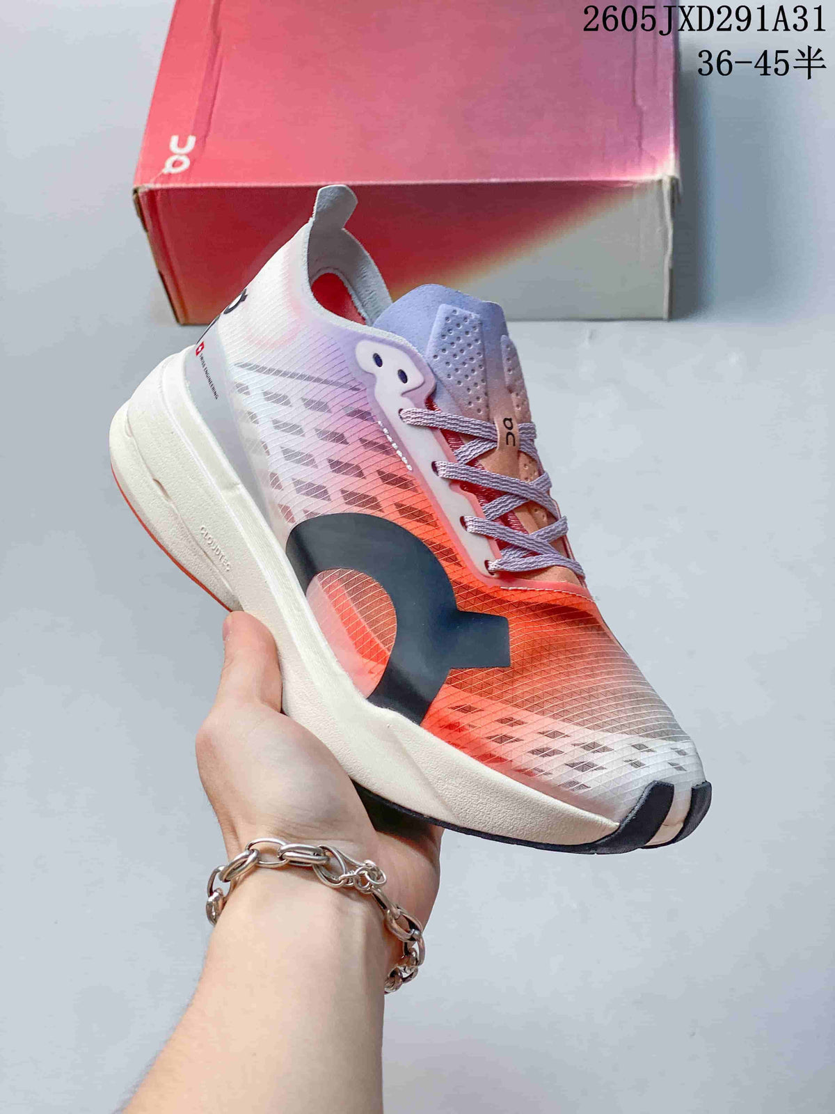 Angled side view of an On Cloudboom Strike shoe in coral, lilac, white, and dark gray.