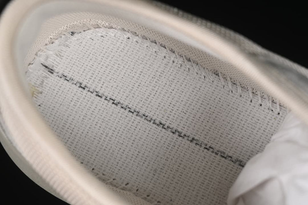 Close-up view inside the sneaker showing the footbed and stitching