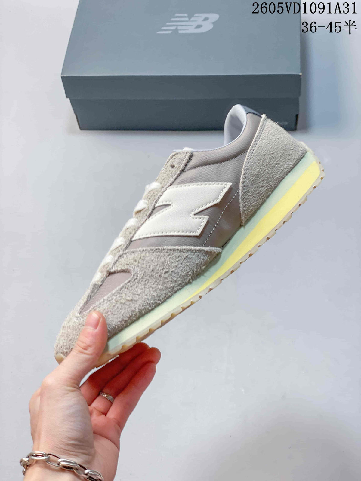 Side view of the gray and cream New Balance 471 sneaker