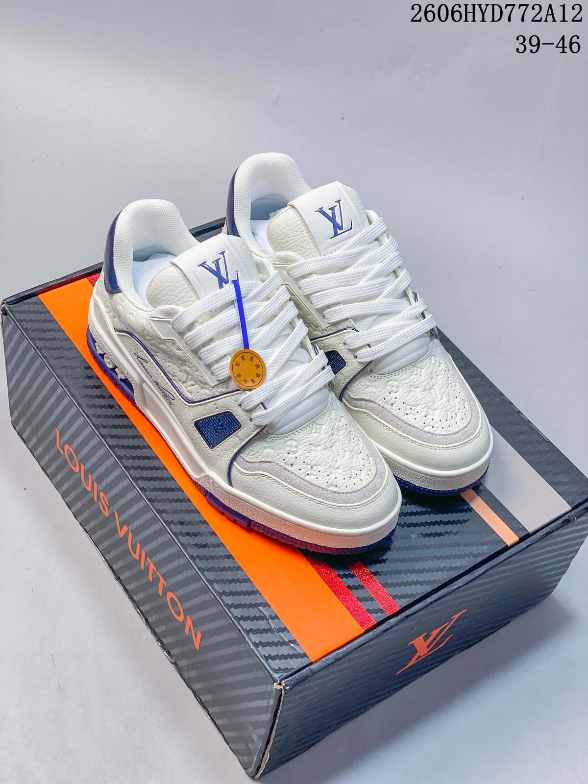 White and blue Louis Vuitton low-top sneakers displayed on a branded box
