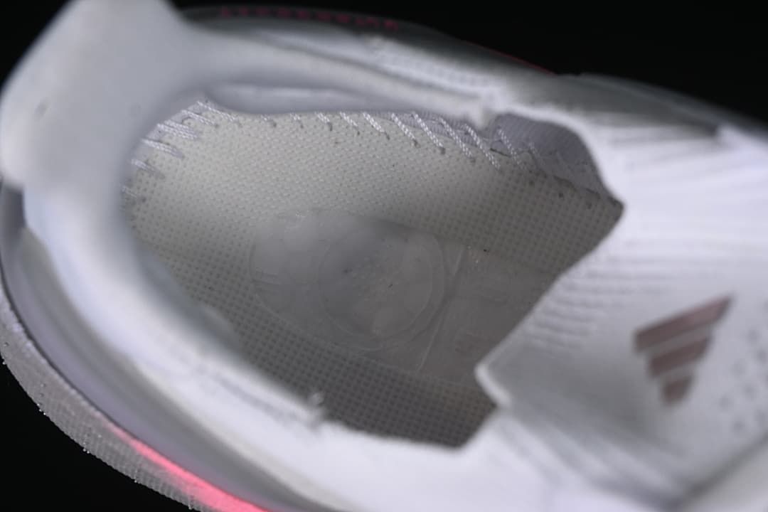 Close-up view inside the white running shoe