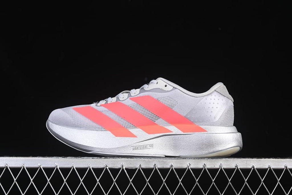 Side view of a light gray Adizero Evo SL shoe with coral stripes