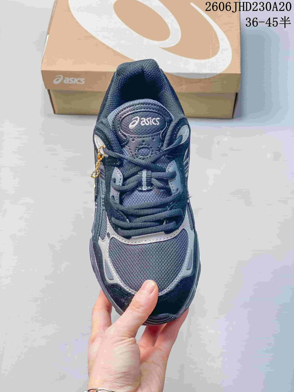 Top view of the mesh toe and lace-up front of an ASICS sneaker