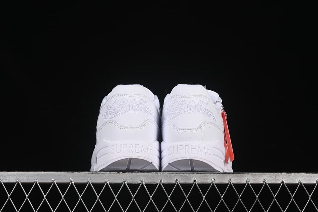 Rear view showing embroidered heel details and Supreme lettering