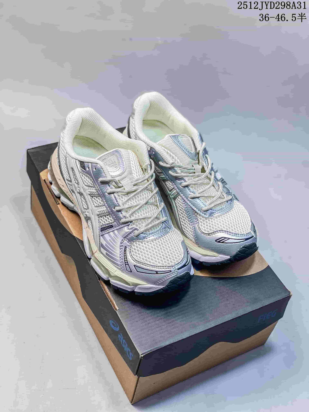 Pair of silver and white running sneakers with light blue and lavender accents.