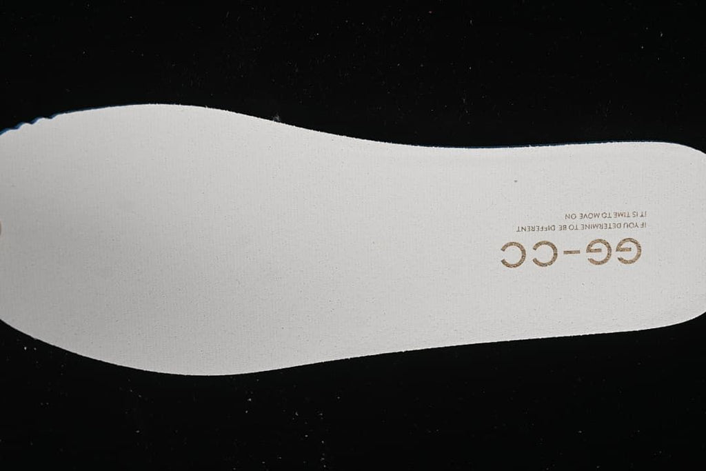 White shoe insert with GG-CC lettering.