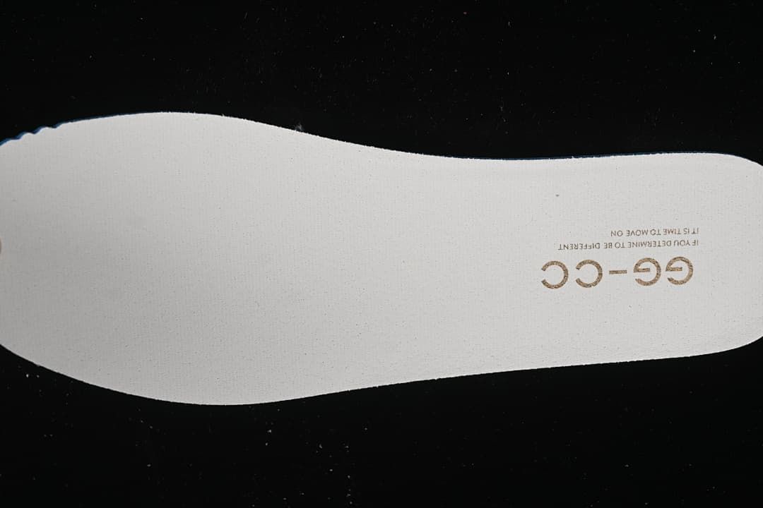 White shoe insert with GG-CC lettering.