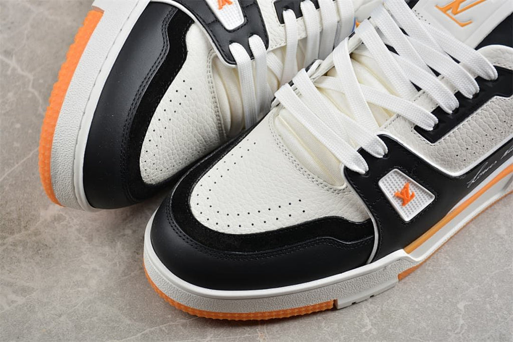 Close-up of the perforated toe and black overlay on the LV Trainer sneaker