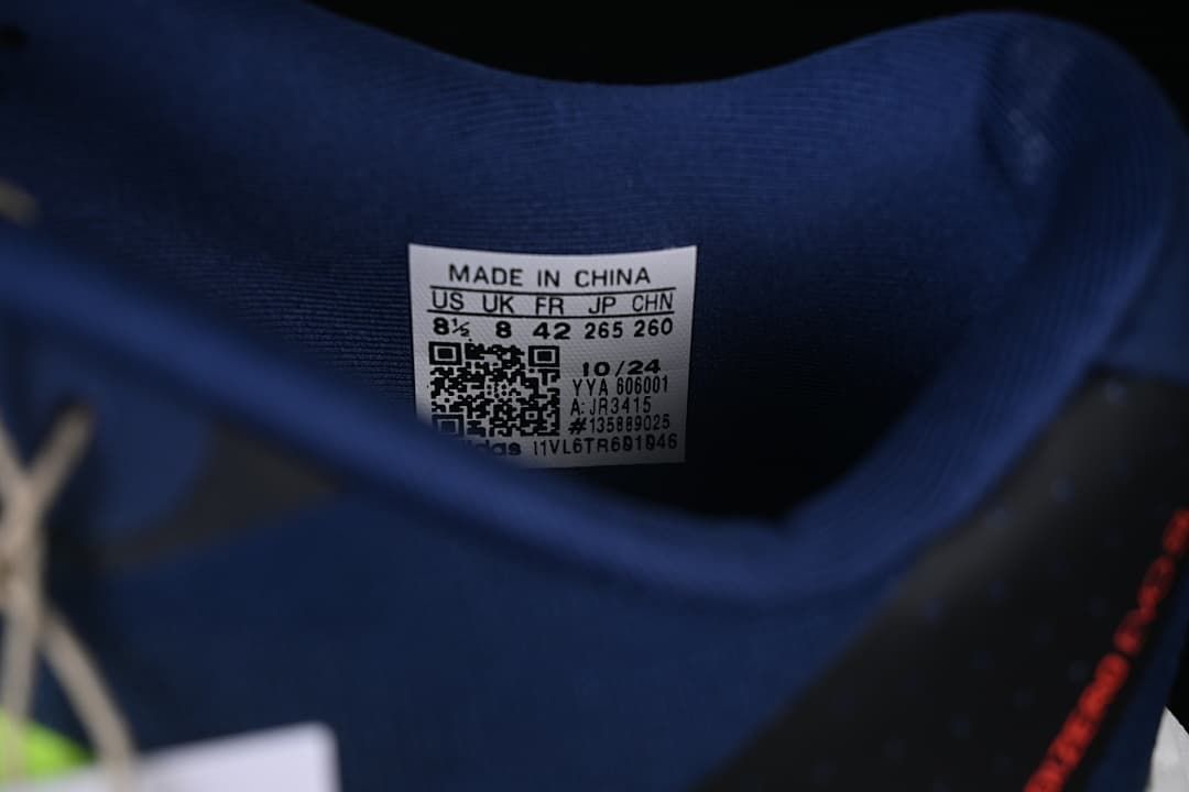 Close-up of the shoe size label showing EU 42 and other sample sizing information.