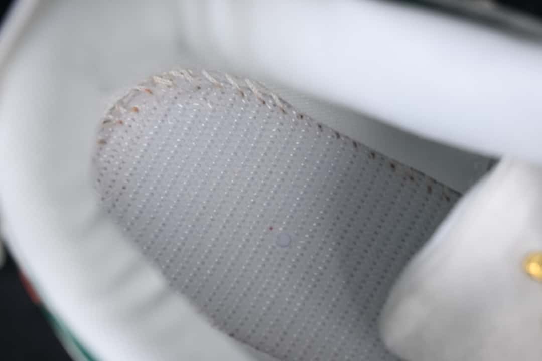 Close-up view inside the sneaker showing a perforated lining