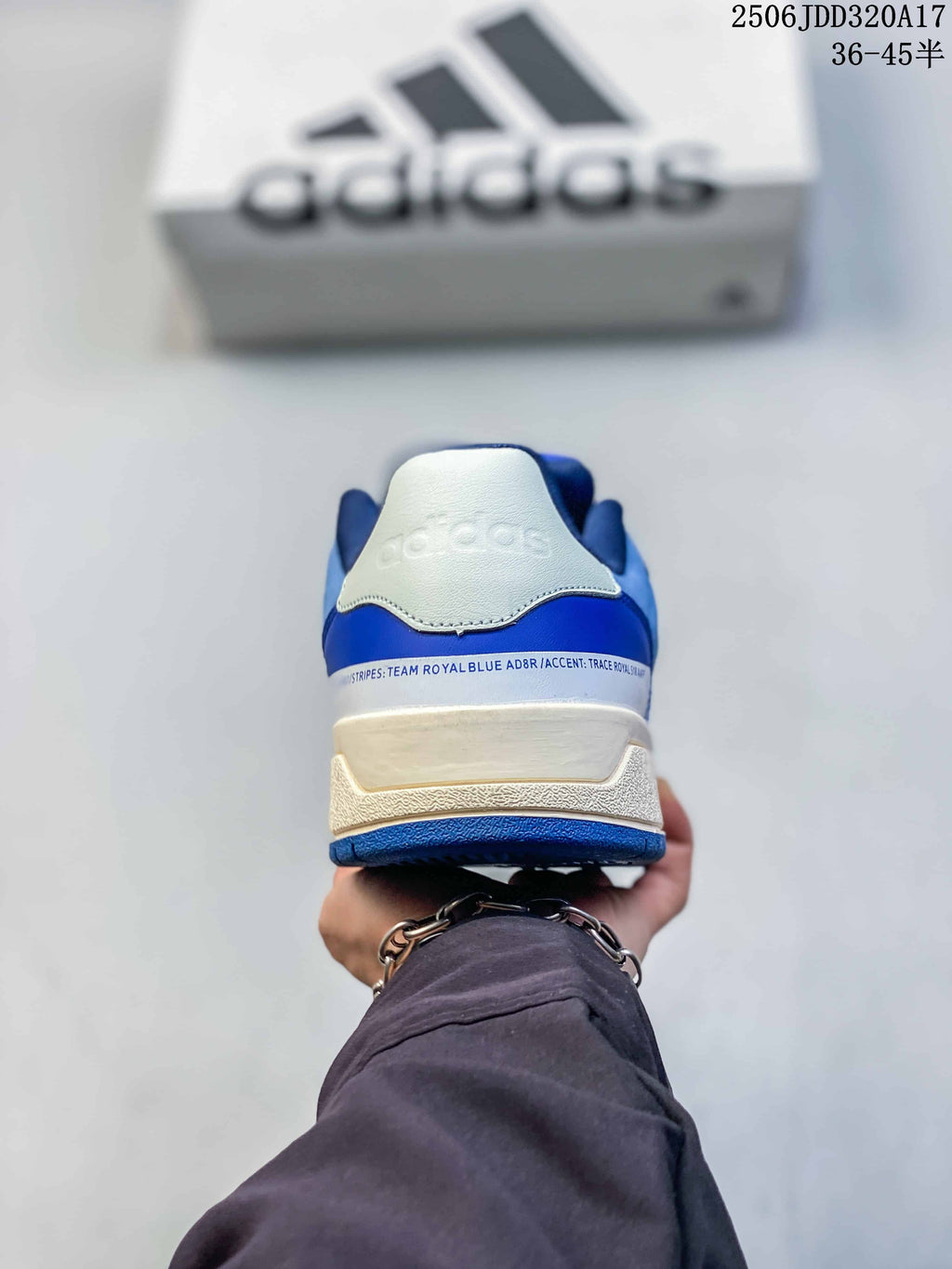 Rear view of the sneaker showing blue heel panels and a light-colored heel tab.