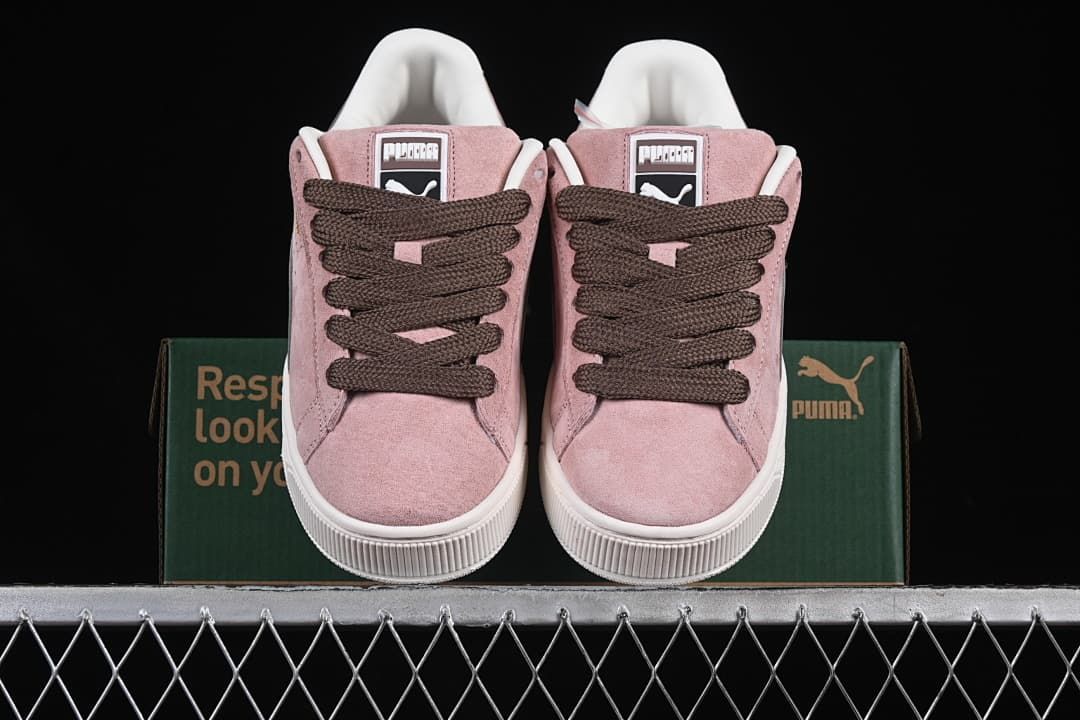 Front view of the pair showing the pink uppers and dark brown laces.