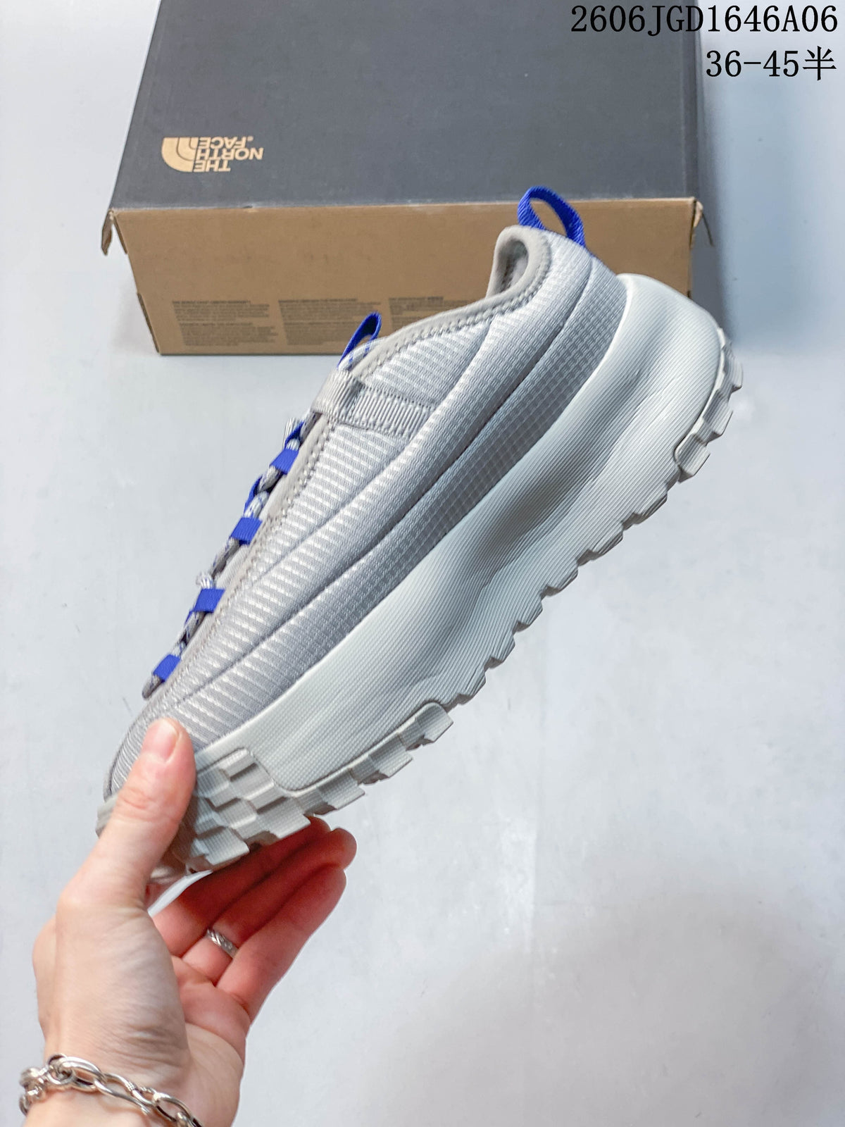 Side view of the gray mule shoe with chunky outsole.