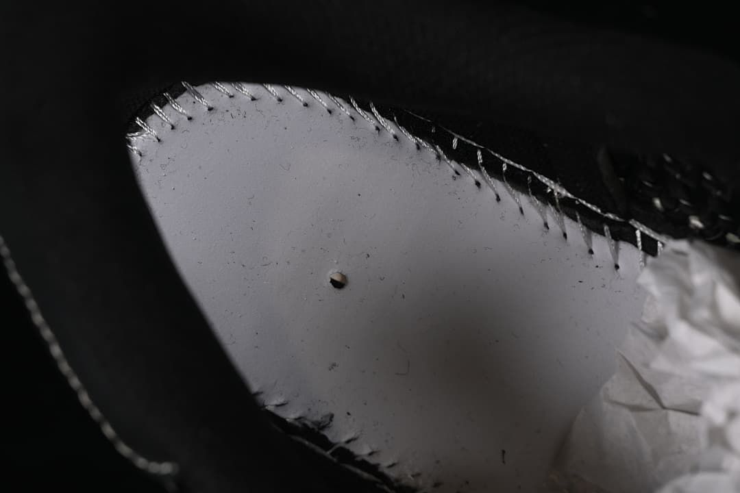 Close-up inside the shoe showing the lining and stitching