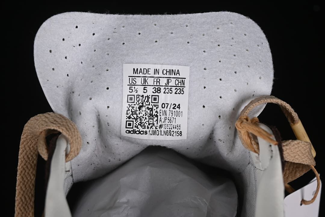 Sneaker tongue label showing sample size markings, JP5671, and other label details.