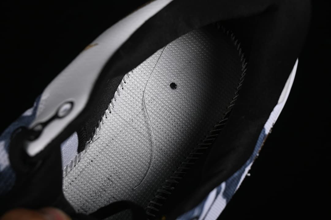 Close-up view inside the shoe, showing the insole and interior lining.