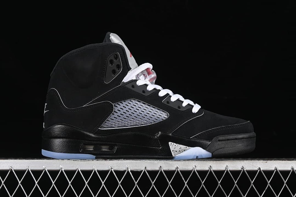 Side profile of the black high-top shoe with silver side panel