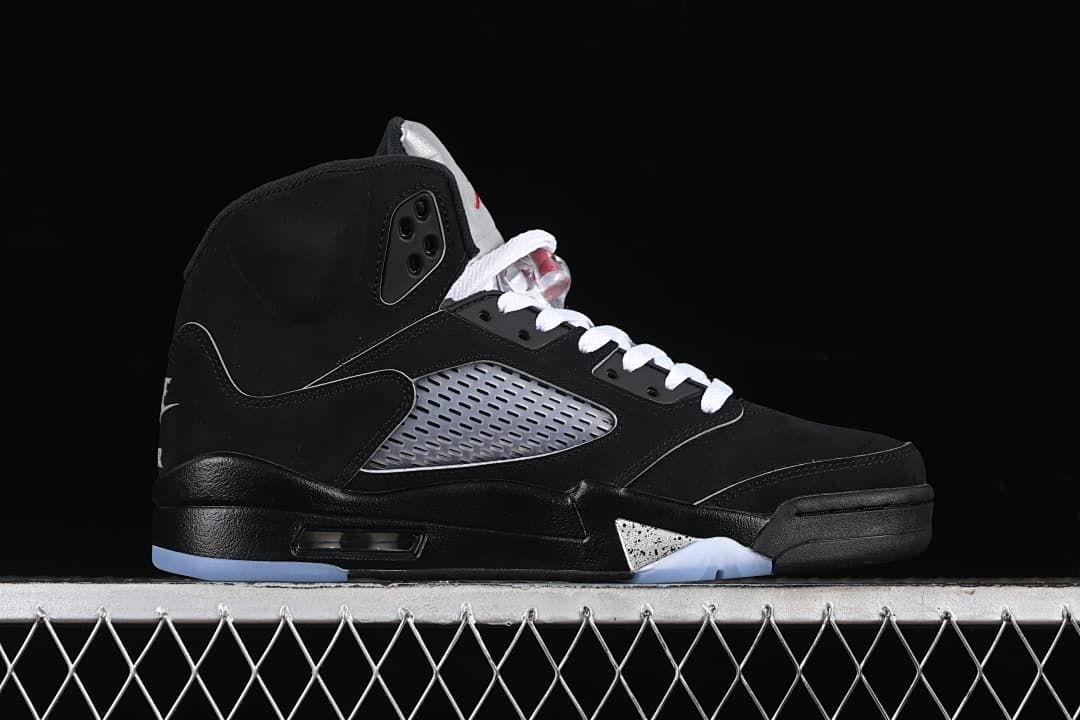 Side profile of the black high-top shoe with silver side panel