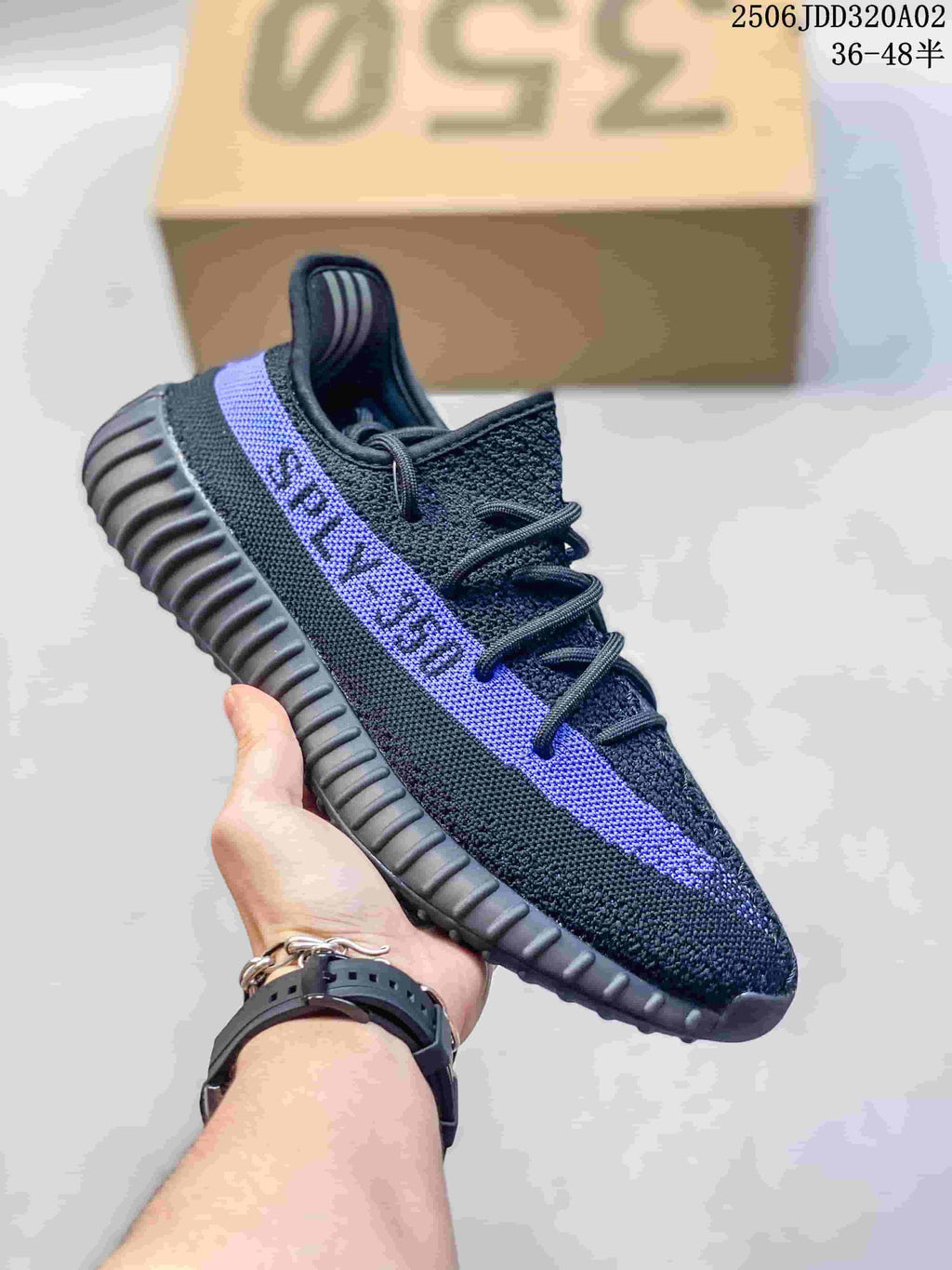 Black knit-look sneaker with a purple side stripe and ribbed dark sole