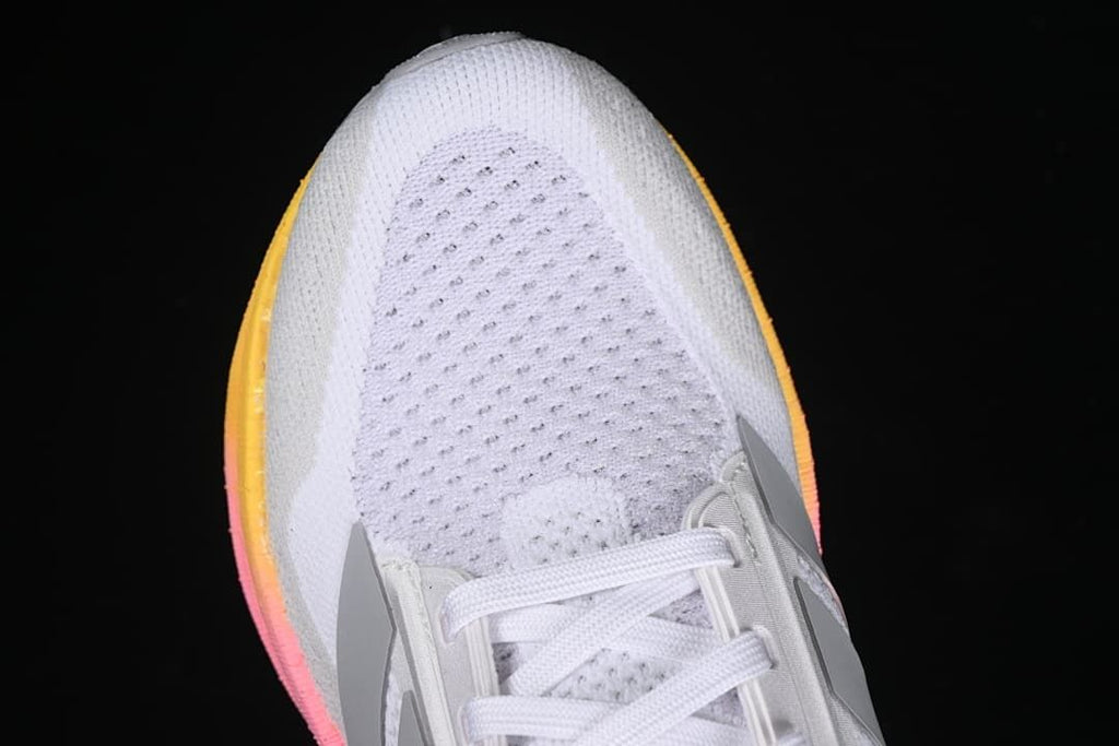 Close-up of the perforated white toe area and laces