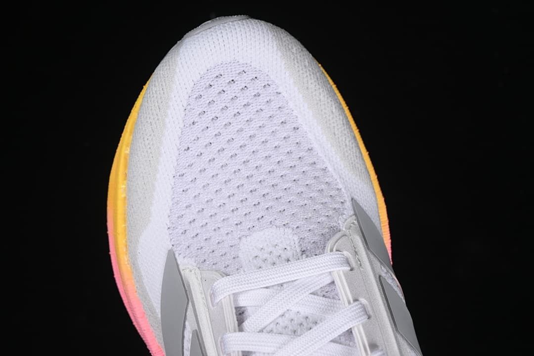 Close-up of the perforated white toe area and laces