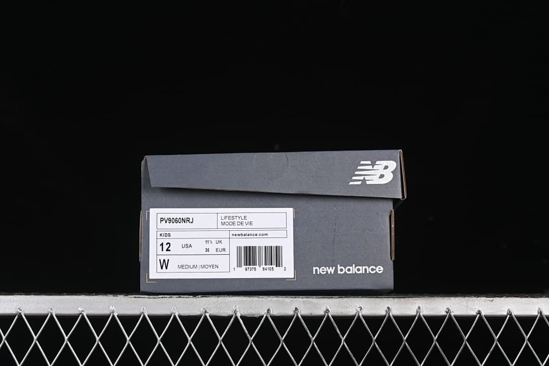 New Balance shoe box label showing the kids sizing for the photographed sample.