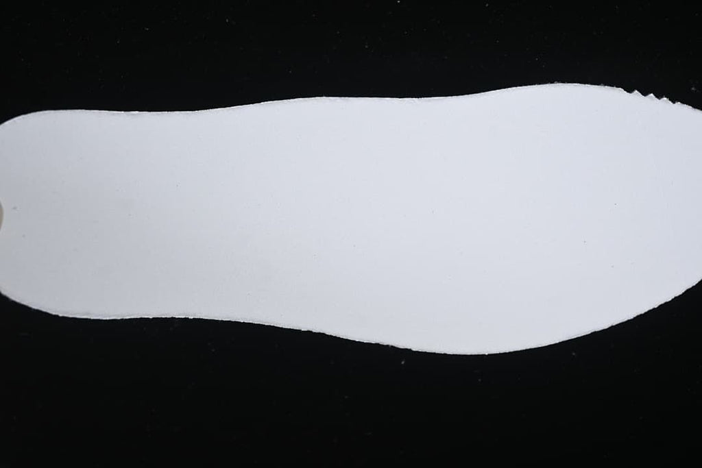 Plain white insole shown from above