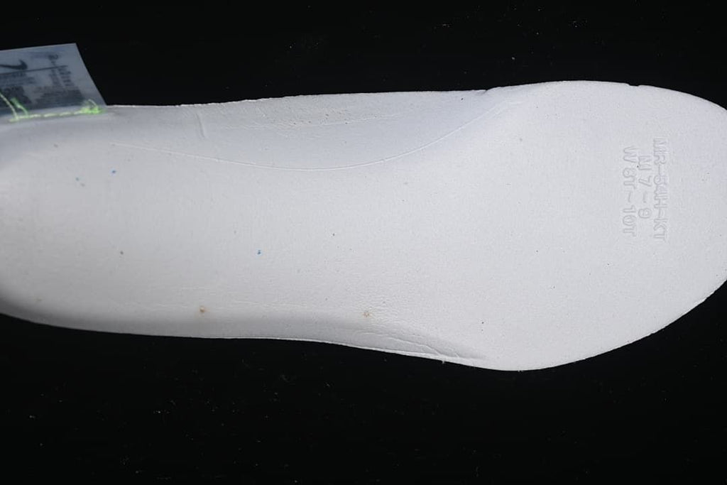Close-up of the white underside of a shoe