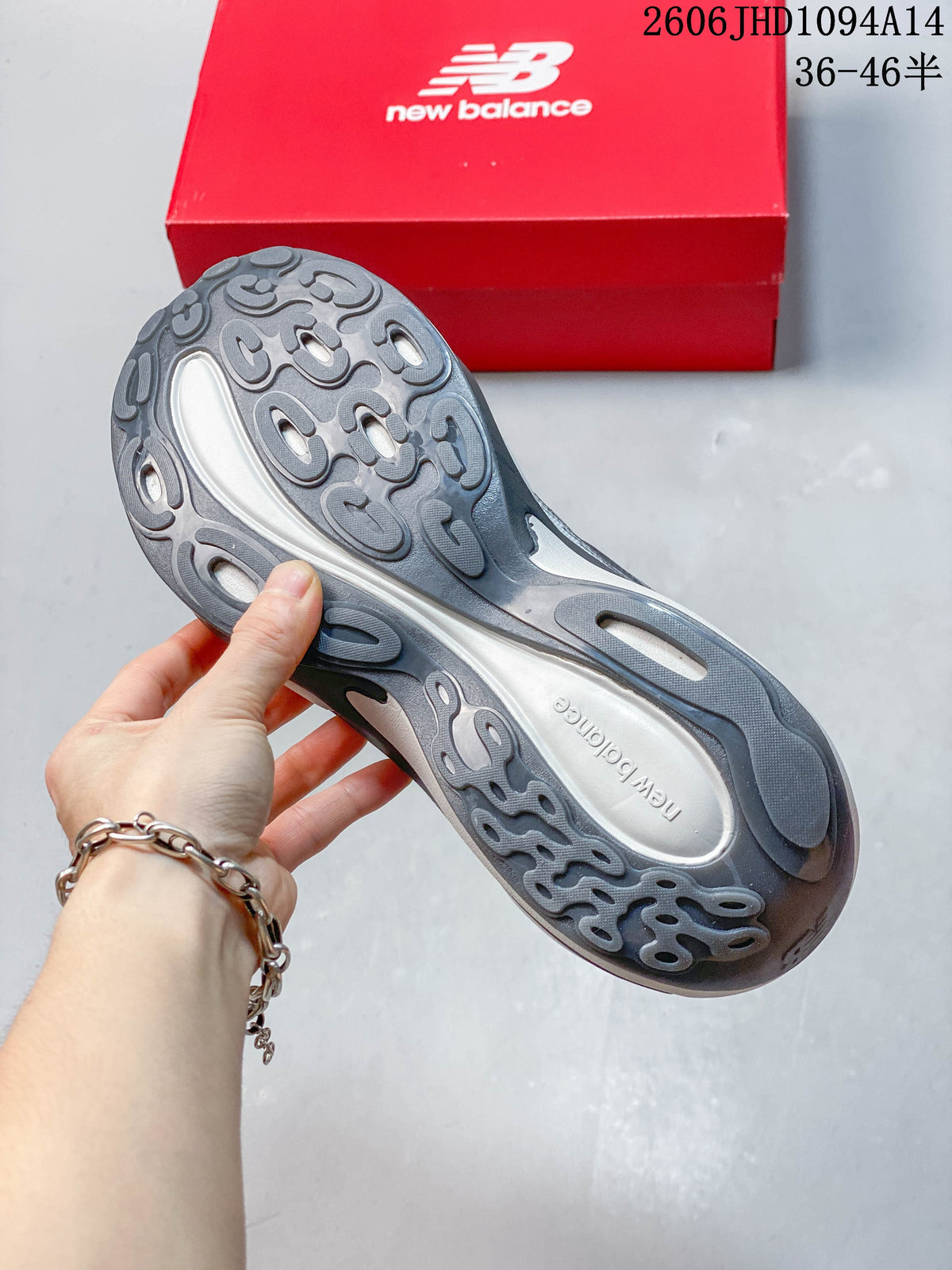 Underside of the gray sneaker showing its sculpted outsole