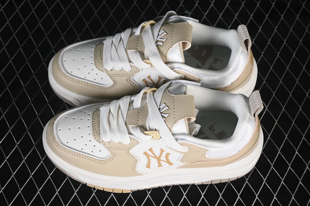 Pair of beige and white New York Yankees MLB sneakers shown from above
