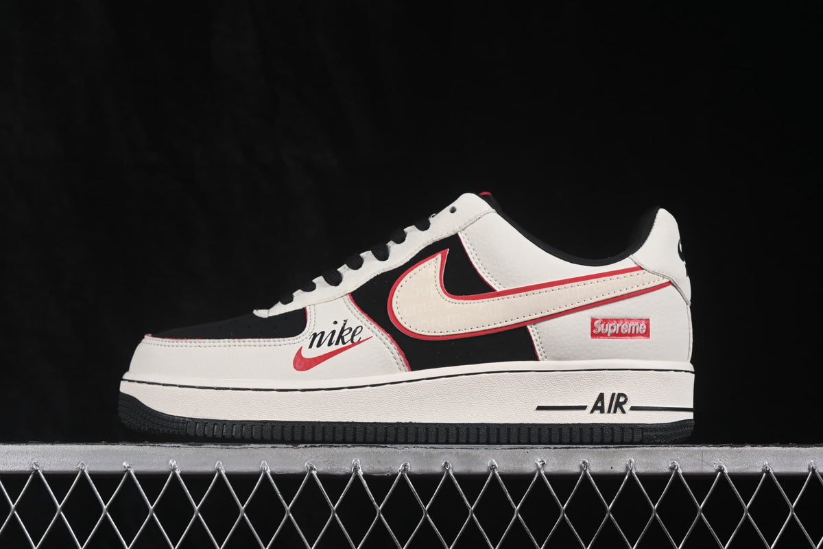 Side profile showing the low-top construction, Swoosh branding, red accents and Air-marked midsole.