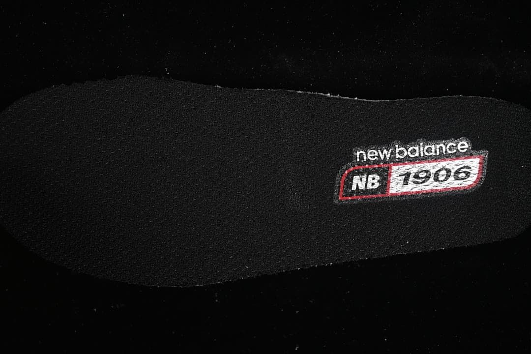 Close-up of an insole marked New Balance 1906R.