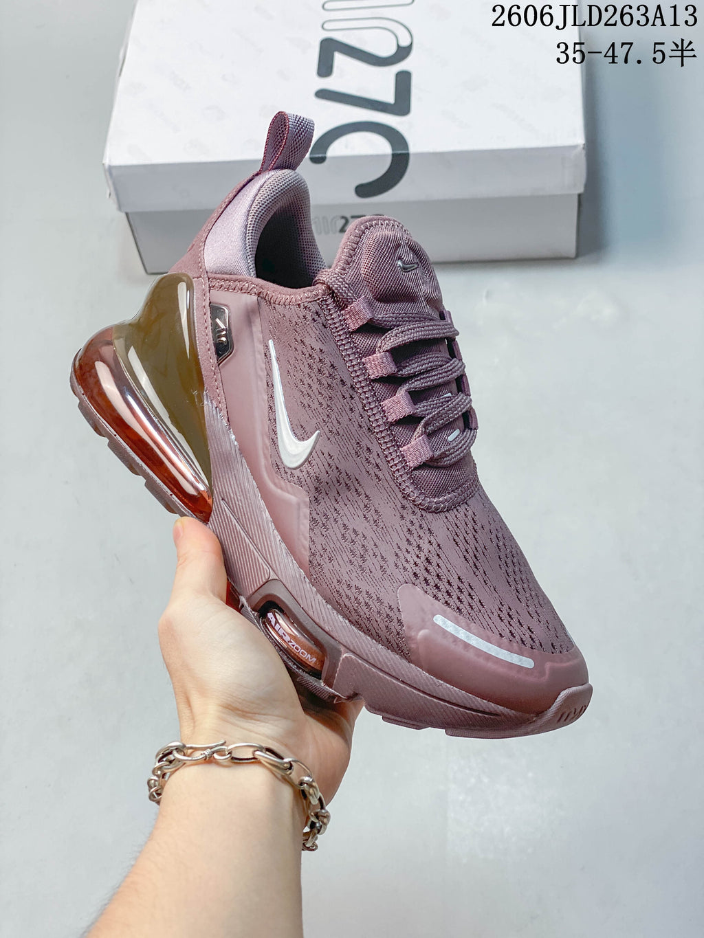 Close side view of the sneaker showing its Swoosh and heel unit