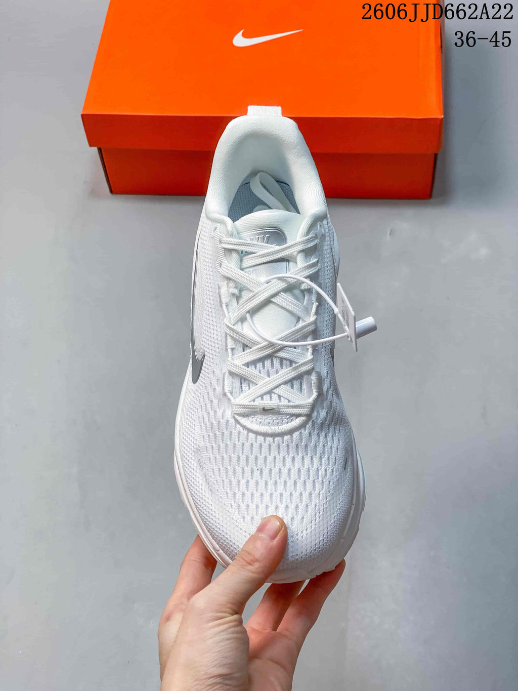 Top view of a white lace-up running shoe