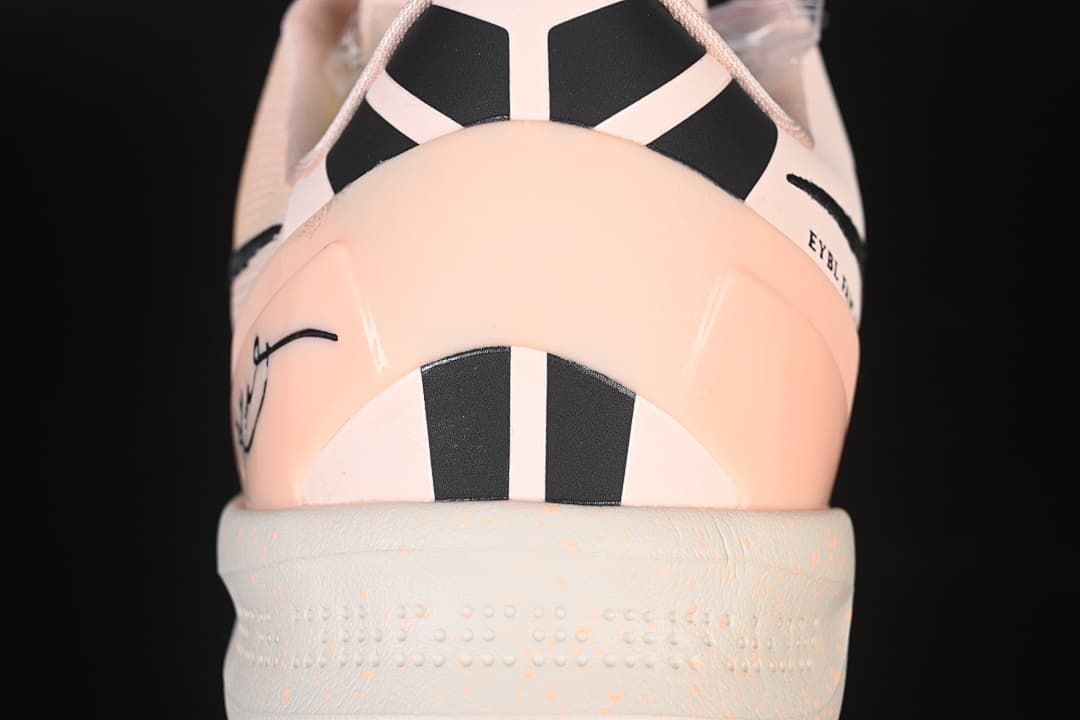 Rear view showing pink heel and black details