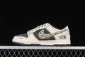 Side view of an off-white and black Nike SB Dunk Low with camouflage panels and patterned Swoosh detail