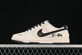 Side view of a cream and black low-top sneaker with graphic side accents