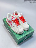 Pair of off-white low-top sneakers with red laces and blue-and-red side detailing on a green box
