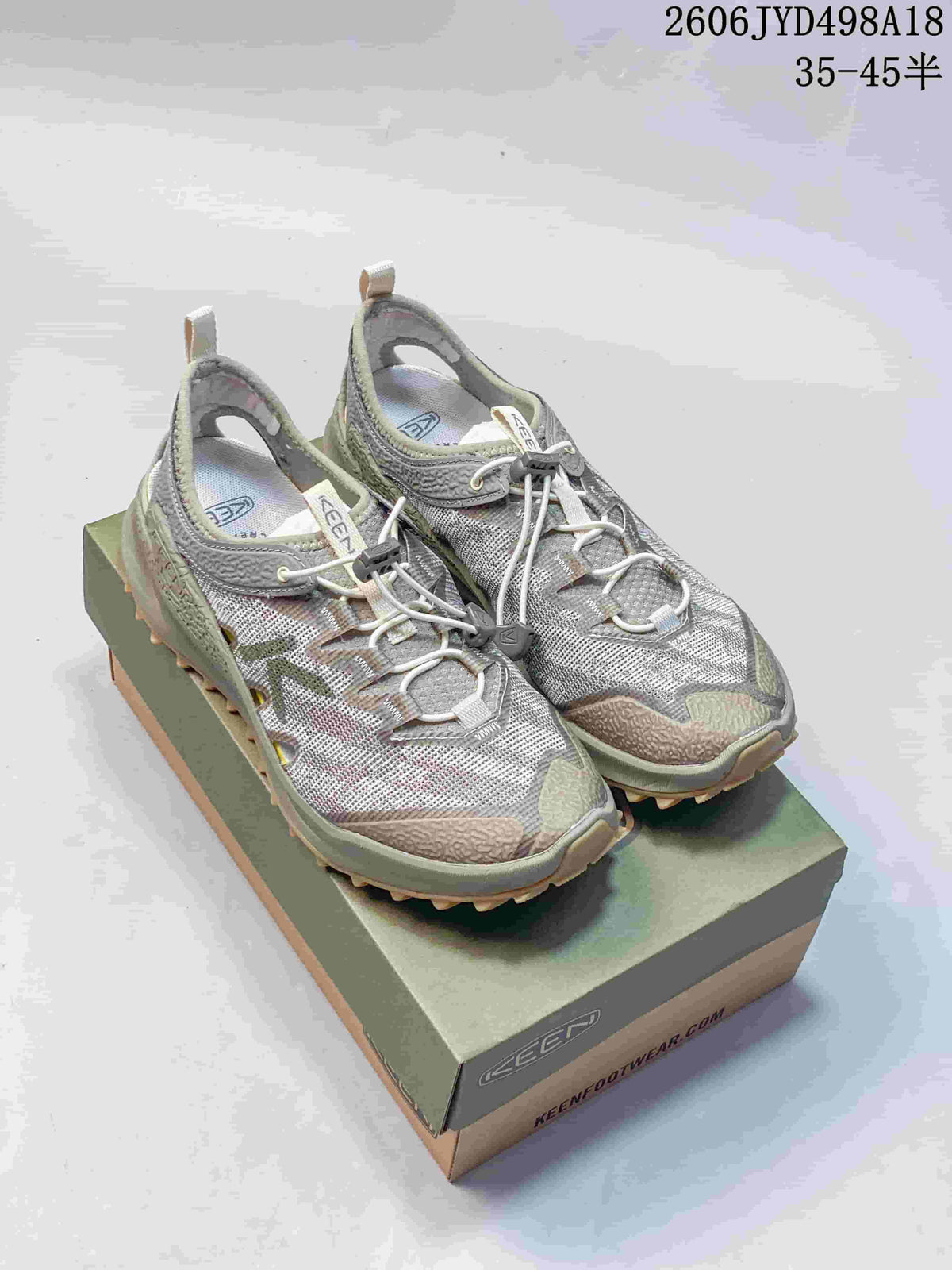 Pair of gray and olive-toned KEEN Jasper Rocks SP sneakers on a shoe box