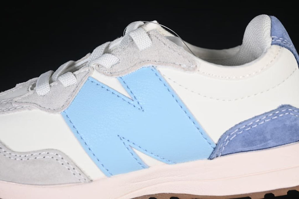 Close-up of the light blue side logo and grey overlays.