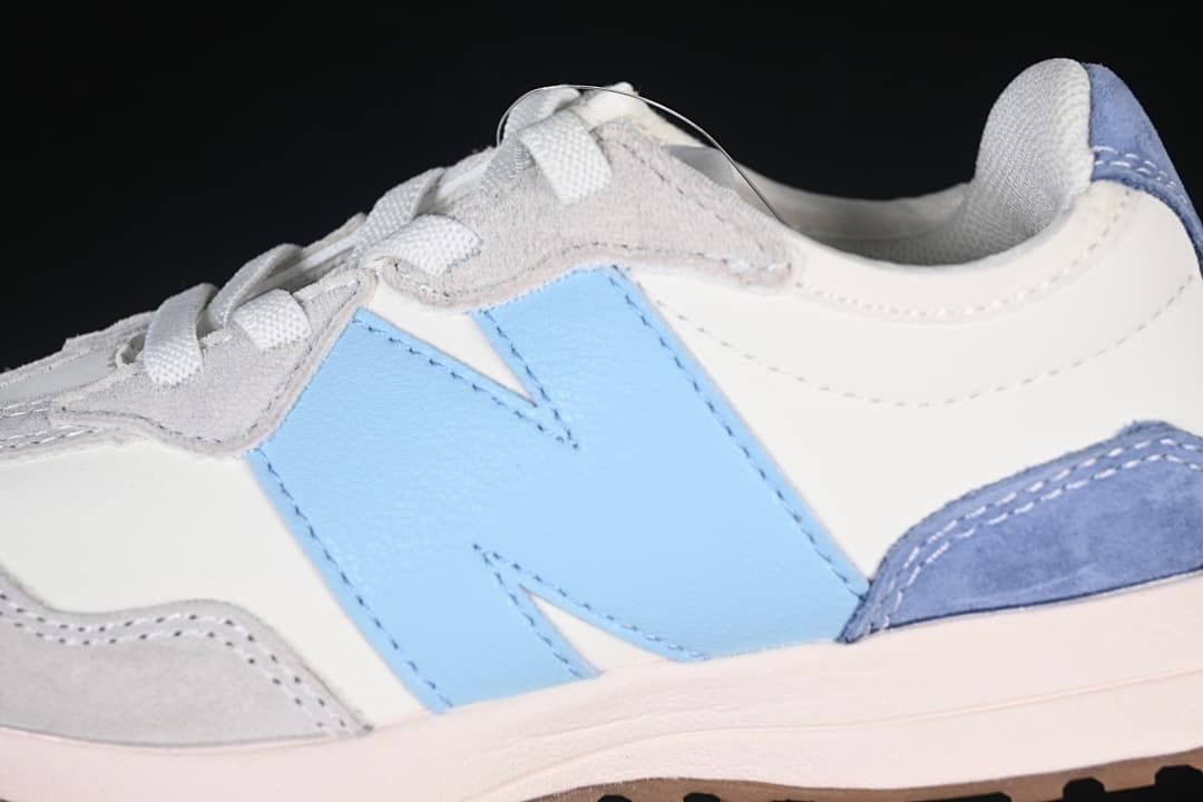 Close-up of the light blue side logo and grey overlays.