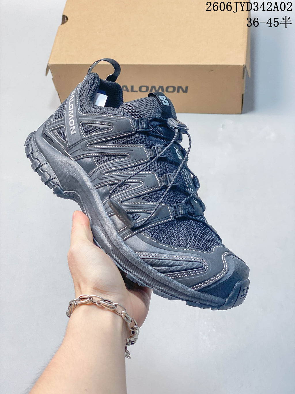 Angled side view of a dark gray Salomon XA Pro 3D trail running shoe