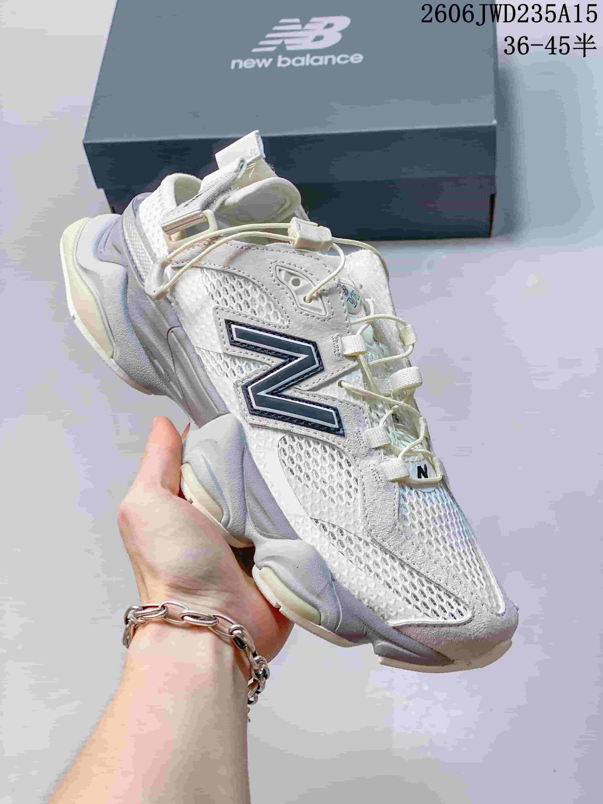 Angled side view of a white and gray New Balance 9060 sneaker