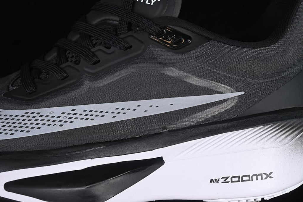 Close-up of the side Swoosh, laces, and midsole