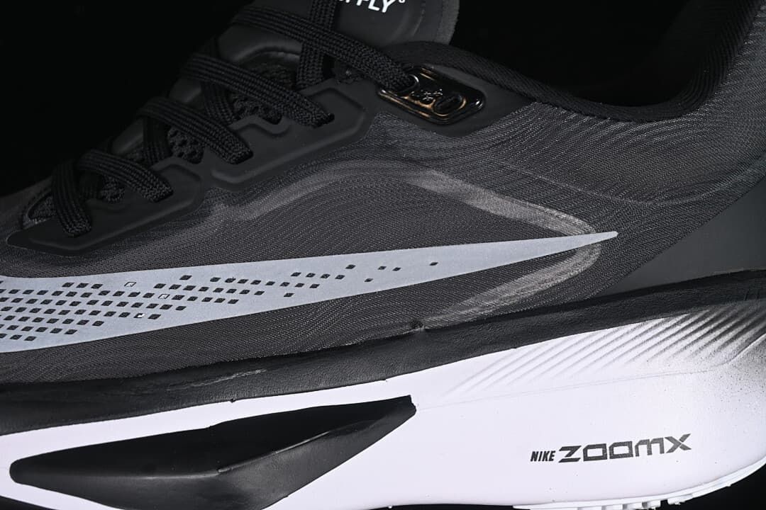 Close-up of the side Swoosh, laces, and midsole